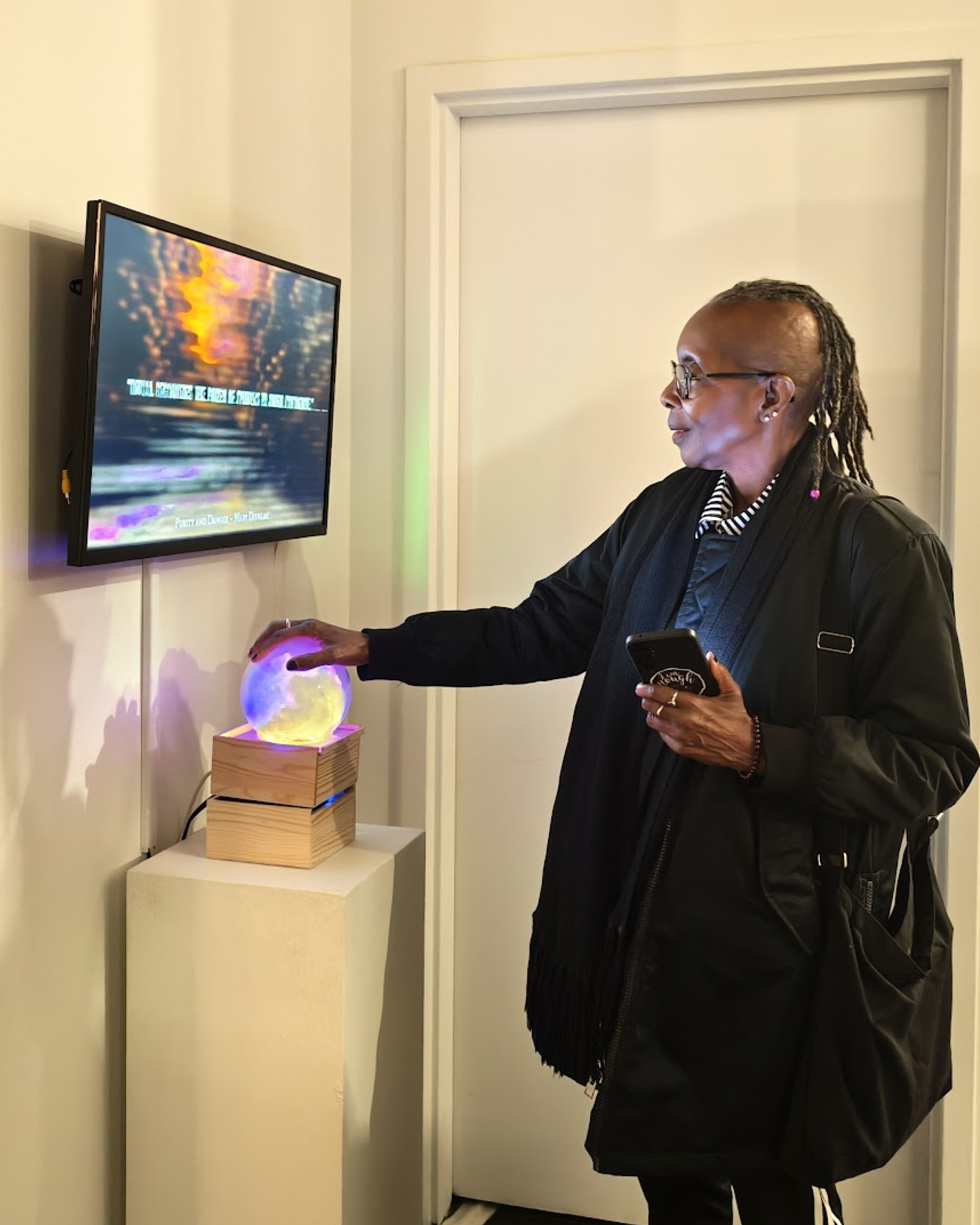 Close-up of visitor triggering audiovisual invocation on Vibe Altar installation